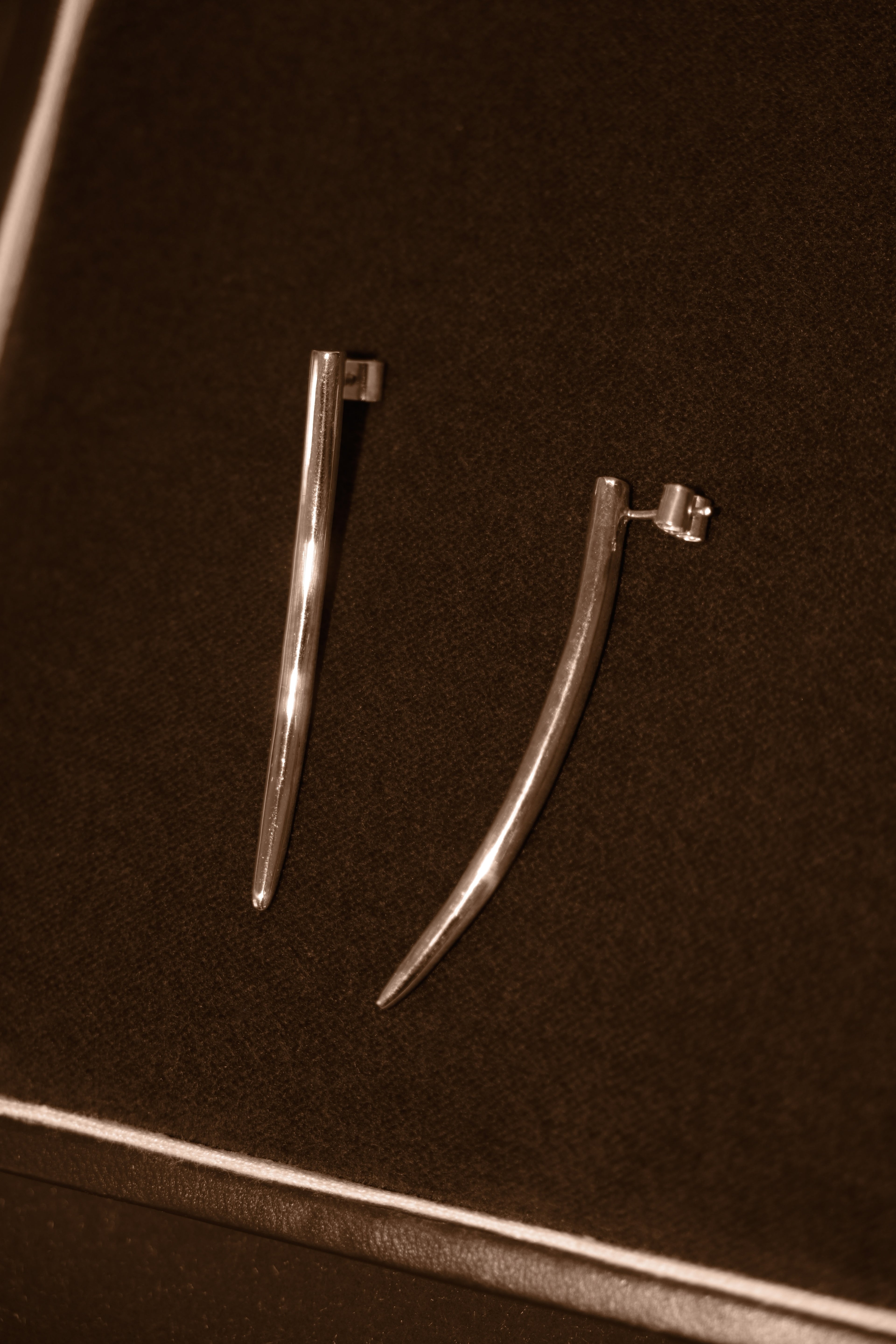 Uma Legorreta Fang earrings pair, editorial.