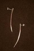 Uma Legorreta Fang earrings pair, editorial.