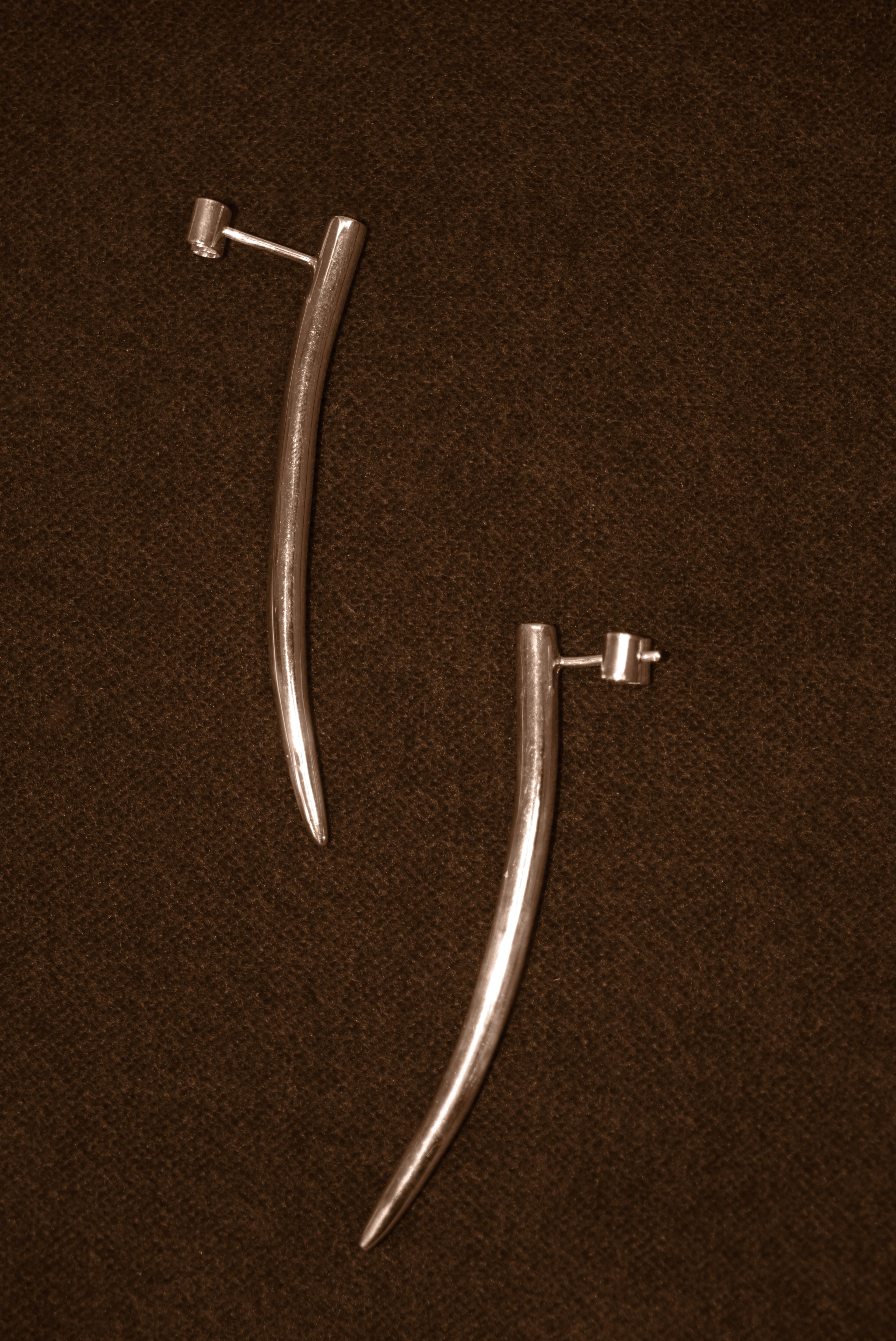 Uma Legorreta Fang earrings pair, editorial.