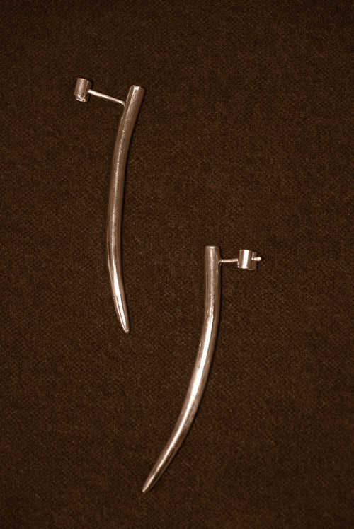 Uma Legorreta Fang earrings pair, editorial.