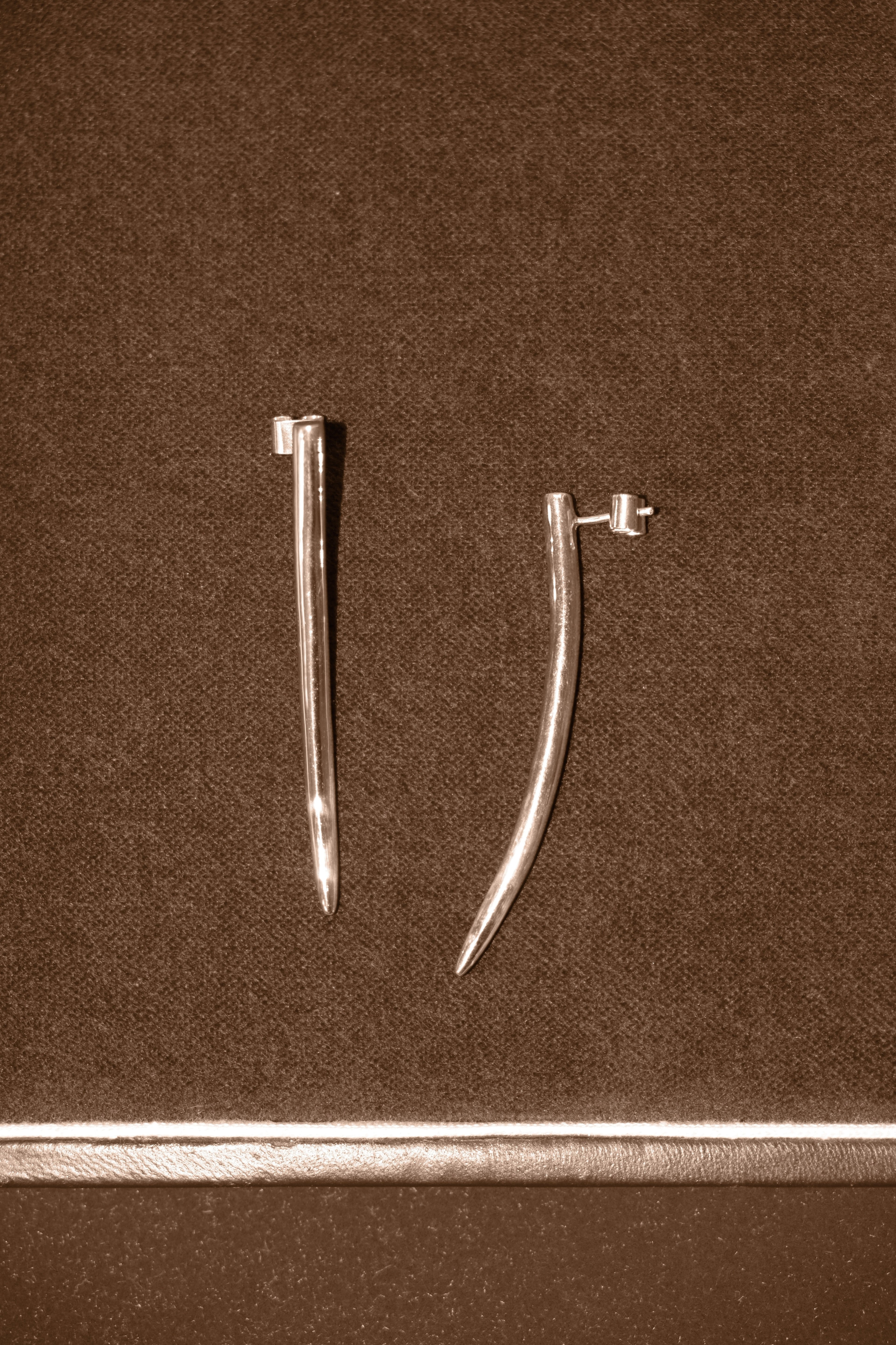 Uma Legorreta Fang earrings pair, editorial.